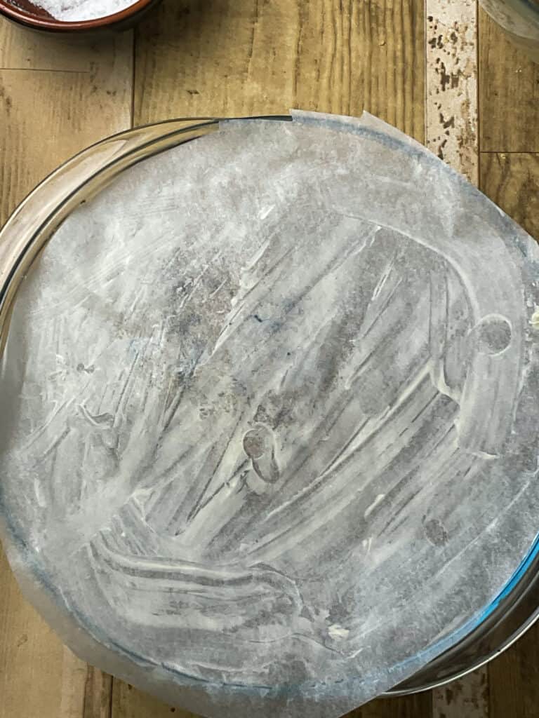 a baking paper lid on top of the haggis casserole dish.