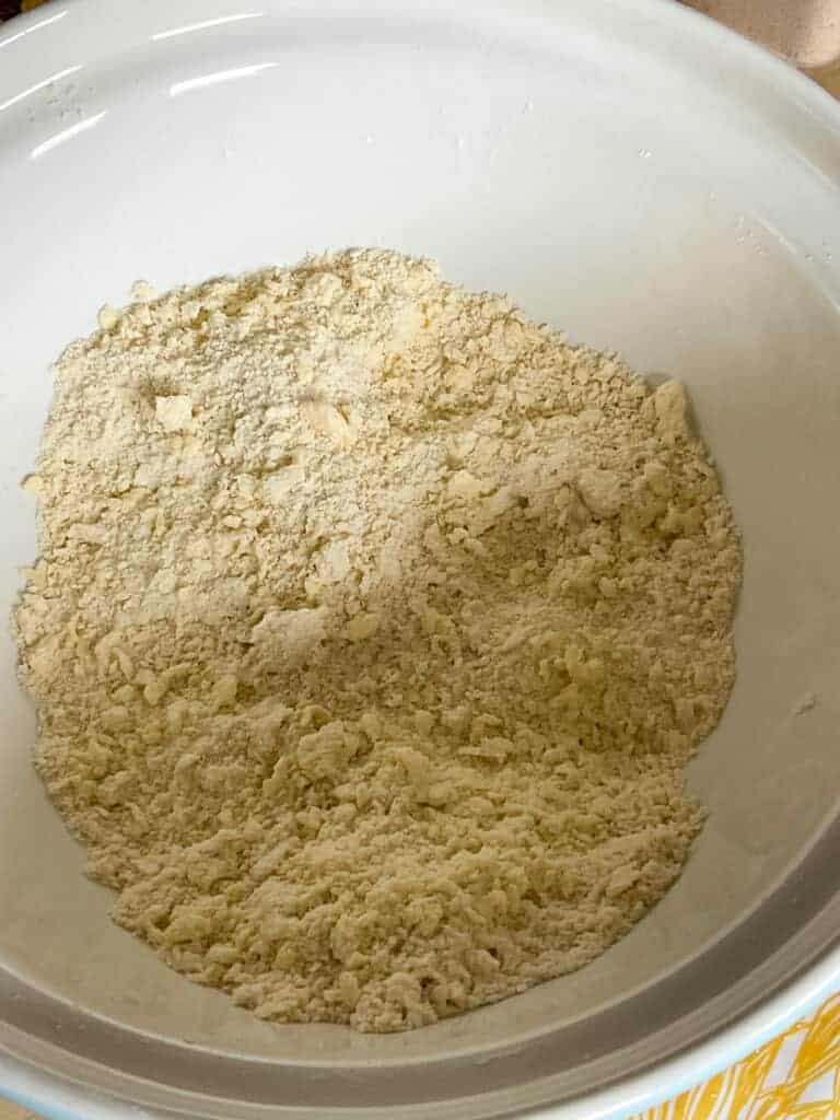 Flour and margarine rubbed in to resemble breadcrumbs in mixing bowl.