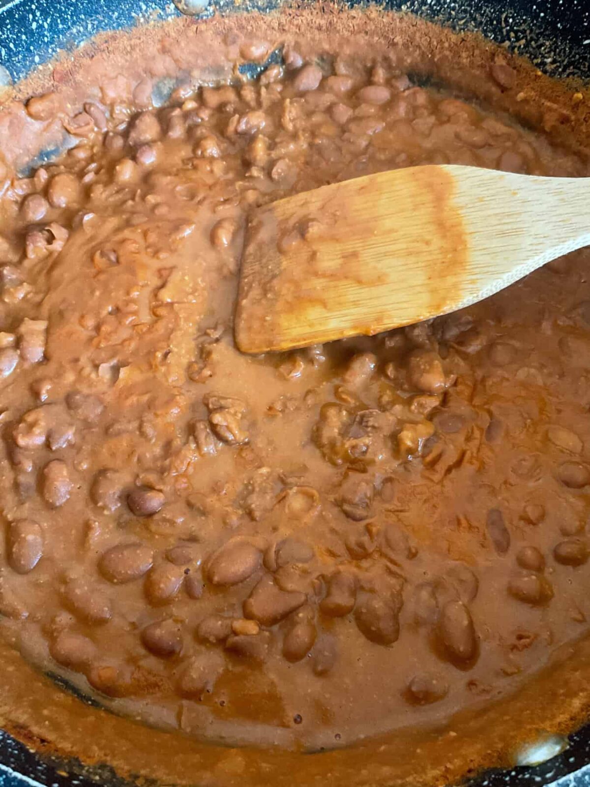 Refried beans cooked in the pan and ready to serve.