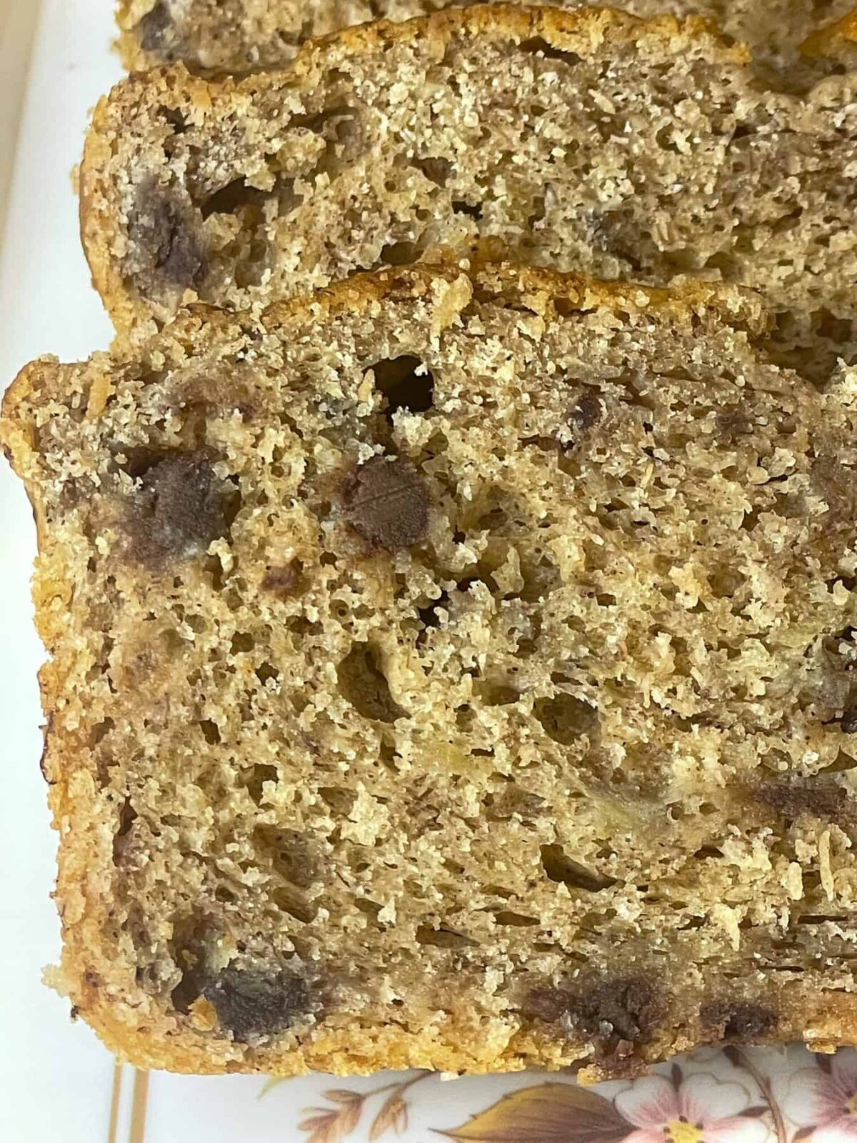 A very close up of two slices of banana bread.