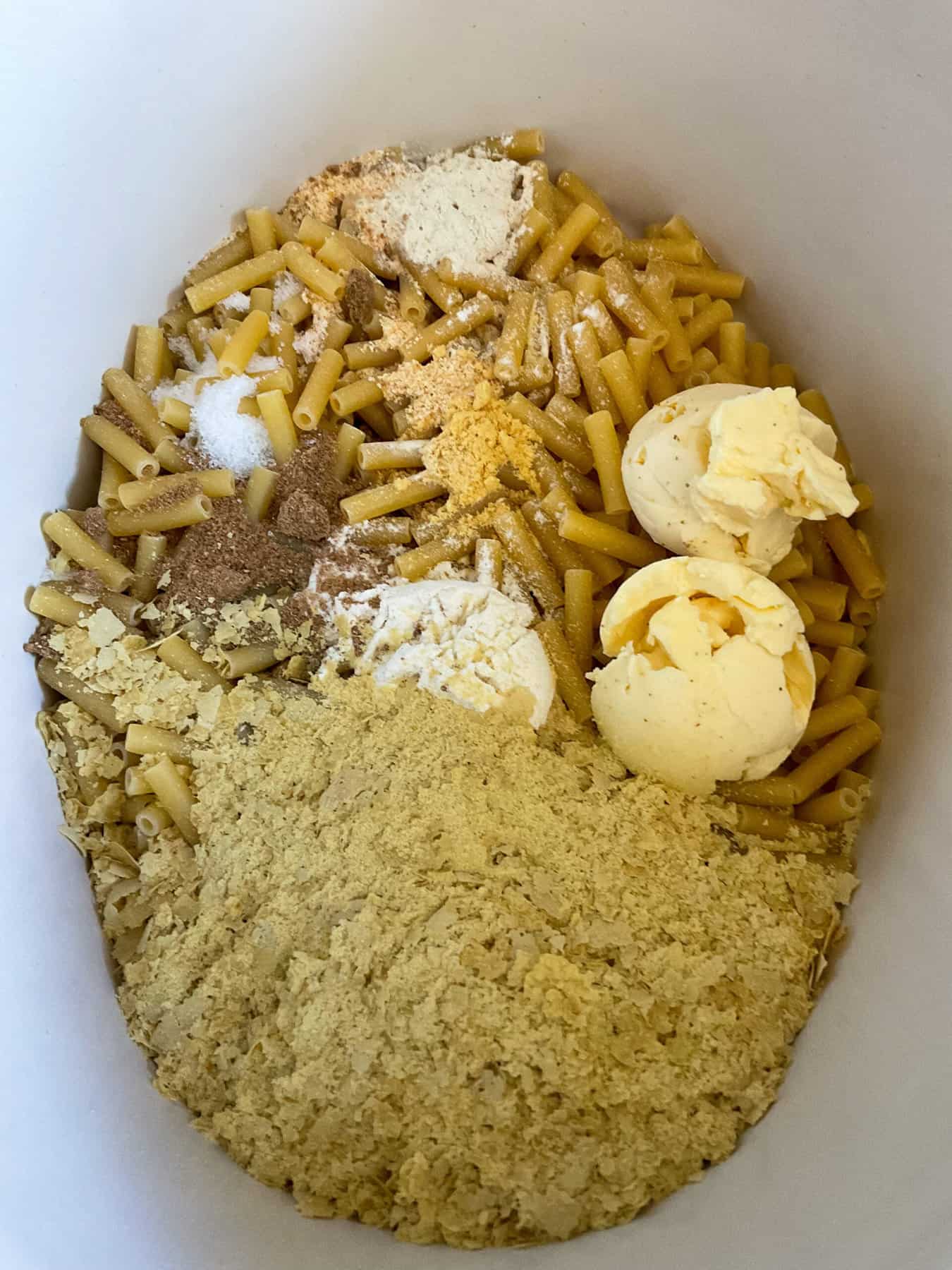 Ingredients added to slow cooker with the macaroni.