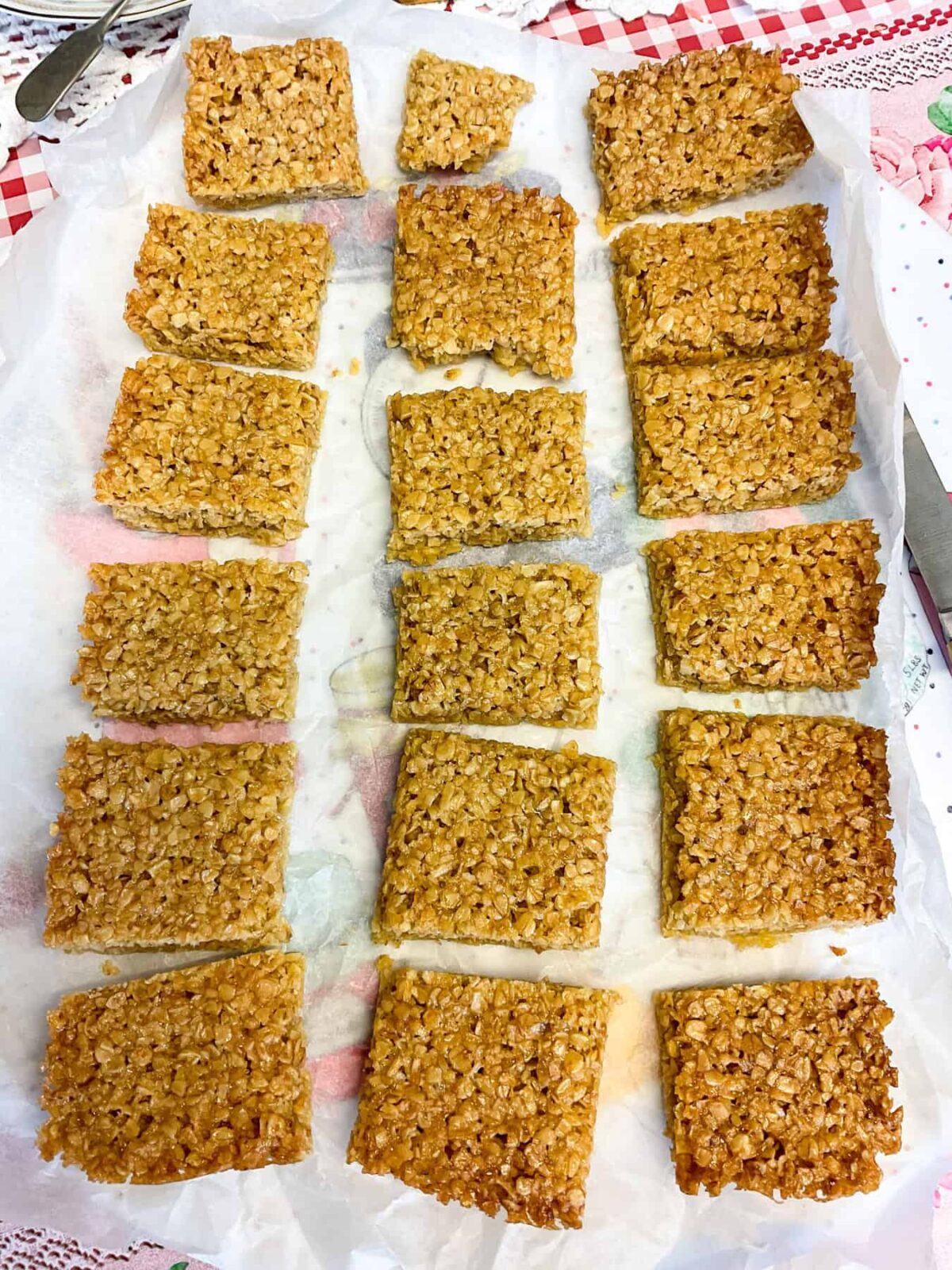 Flapjacks sliced into 18 pieces on the baking paper.