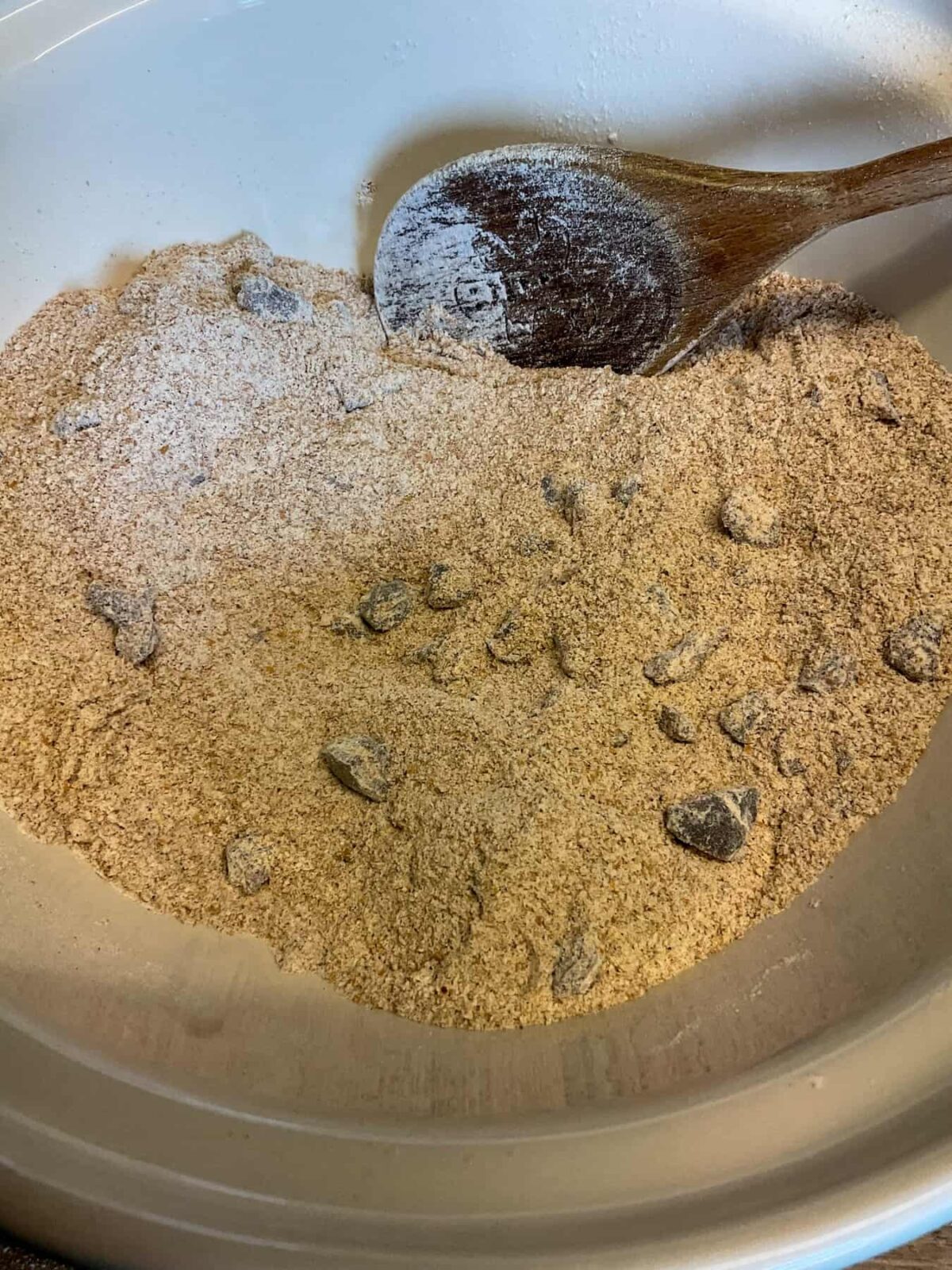 Dates and bran mixed through the dry ingredients in mixing bowl.