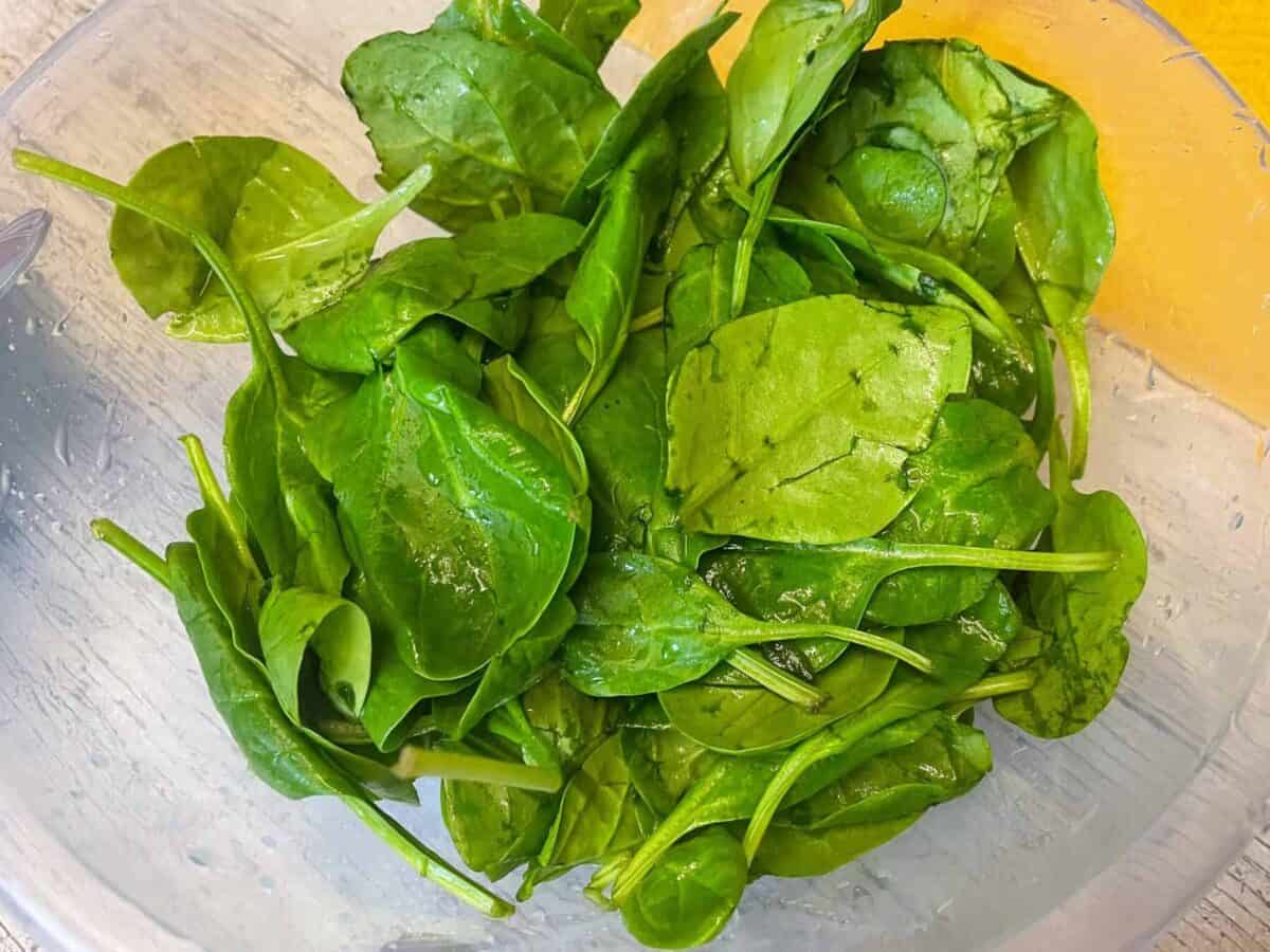 Bowl of spinach leaves.