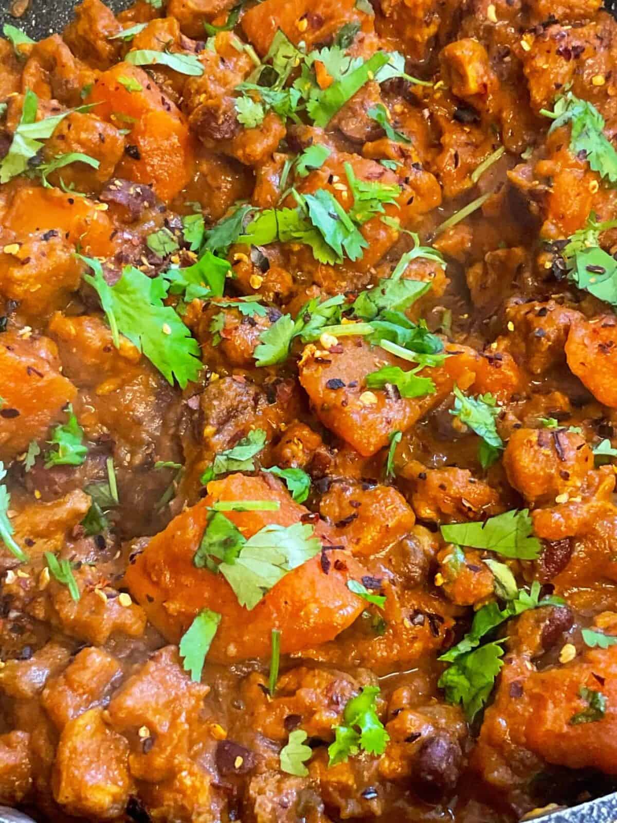 Close up of slow cooker vindaloo garnished with coriander.