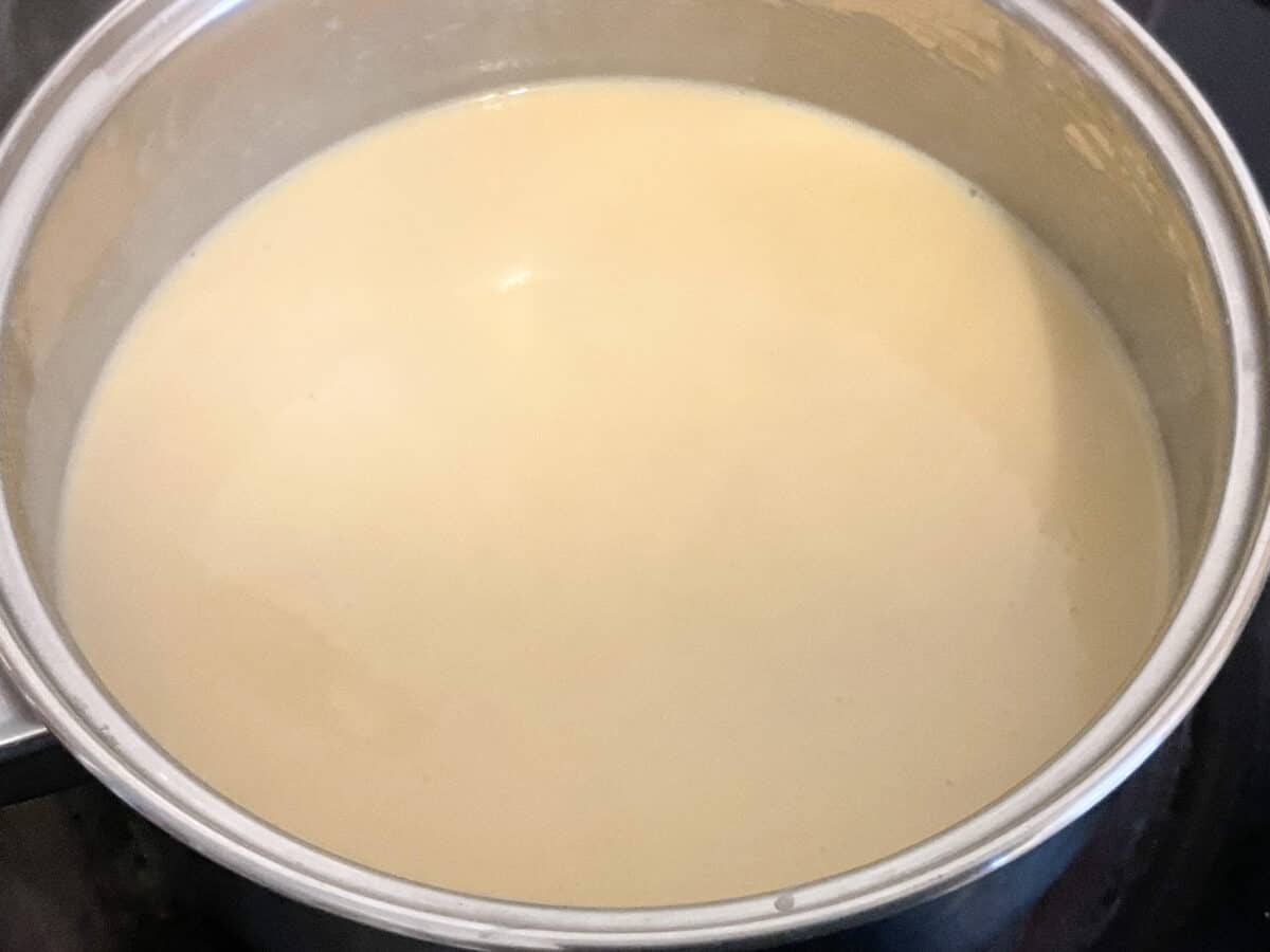 All the milk added to roux and whisked through.
