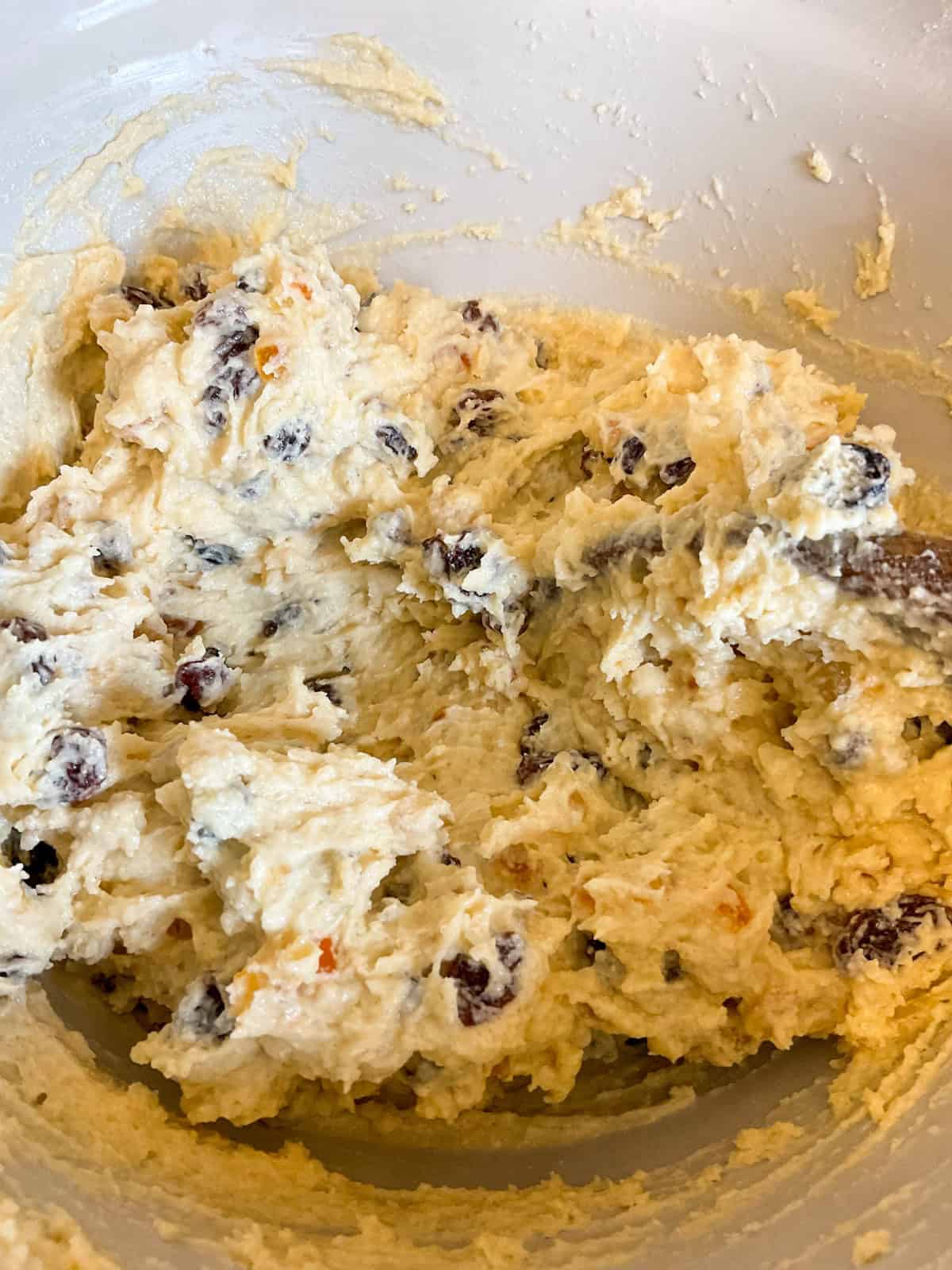 Wet ingredients mixed with dry ingredients in mixing bowl.
