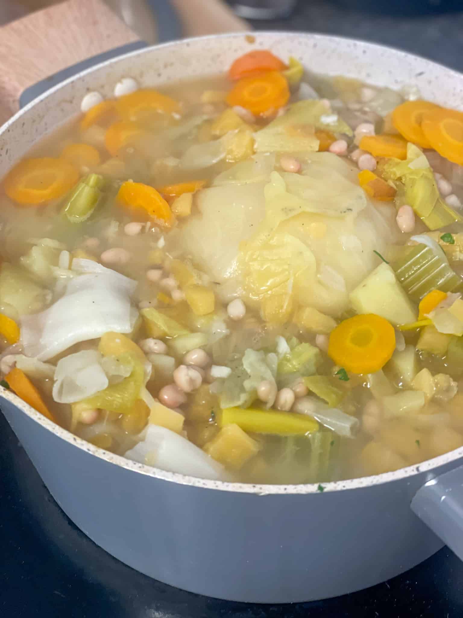 Pottage cooked in soup pot.