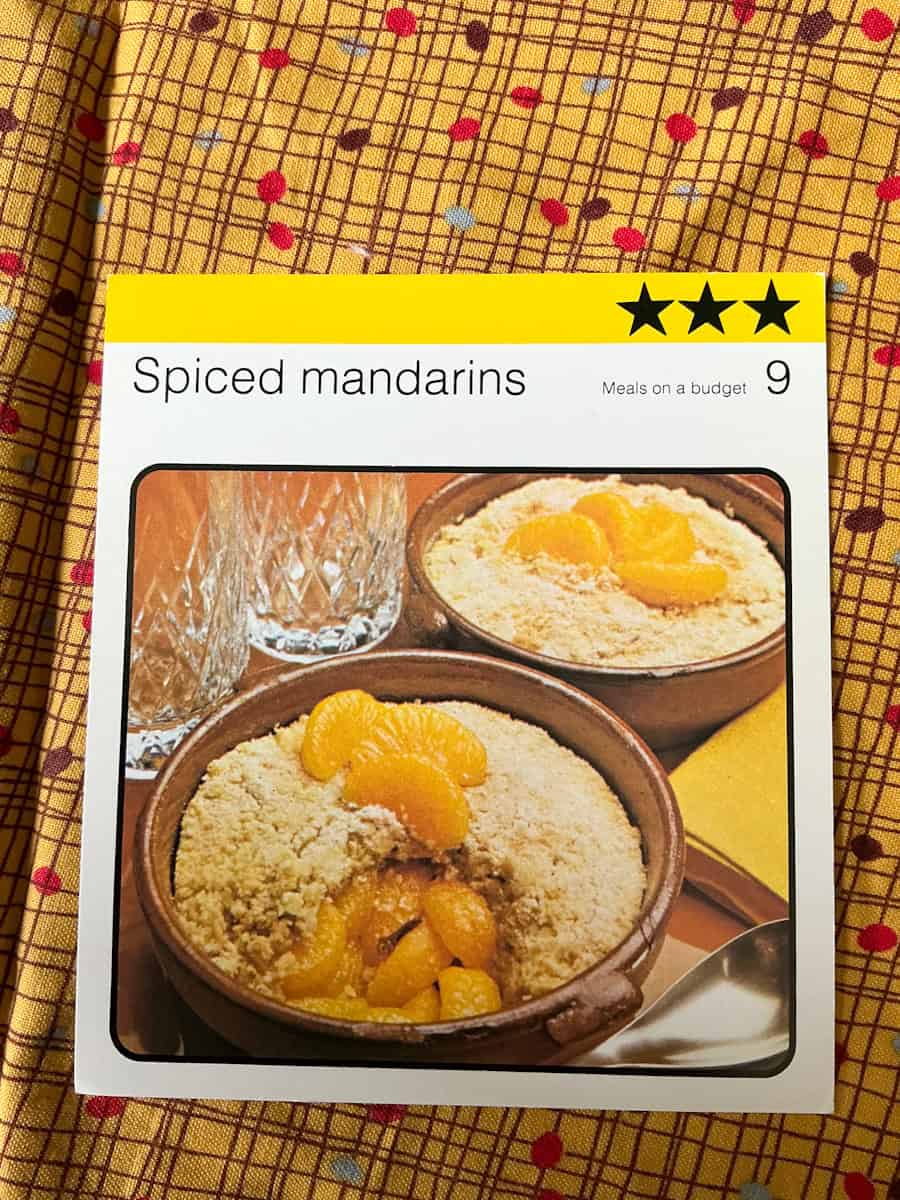 Spiced mandarins recipe card image.