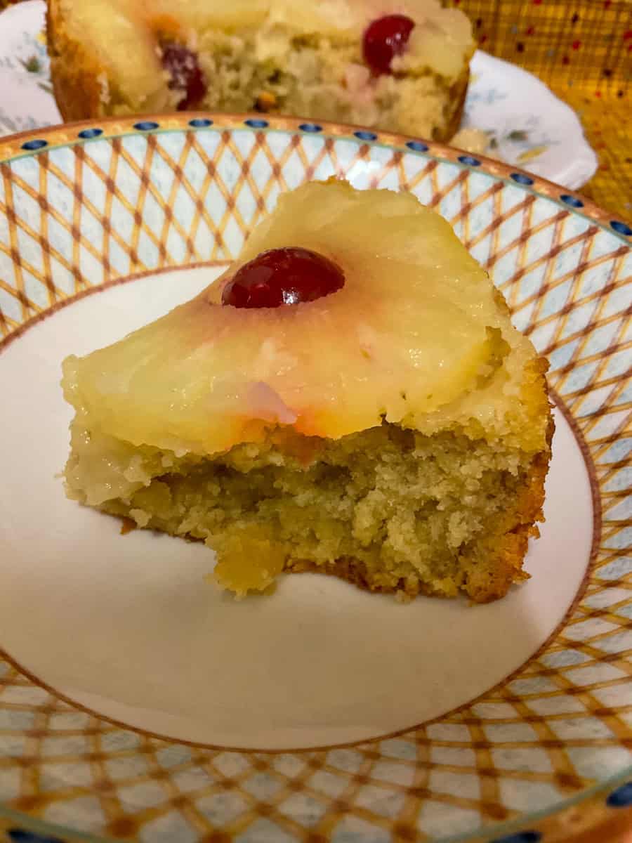 A slice of upside-down pudding on serving bowl.