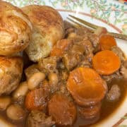 A bowl of vegan Guy Fawkes Stew served with baked potatoes, featured image.