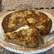 Plate of Duke Pudding with a slice removed.