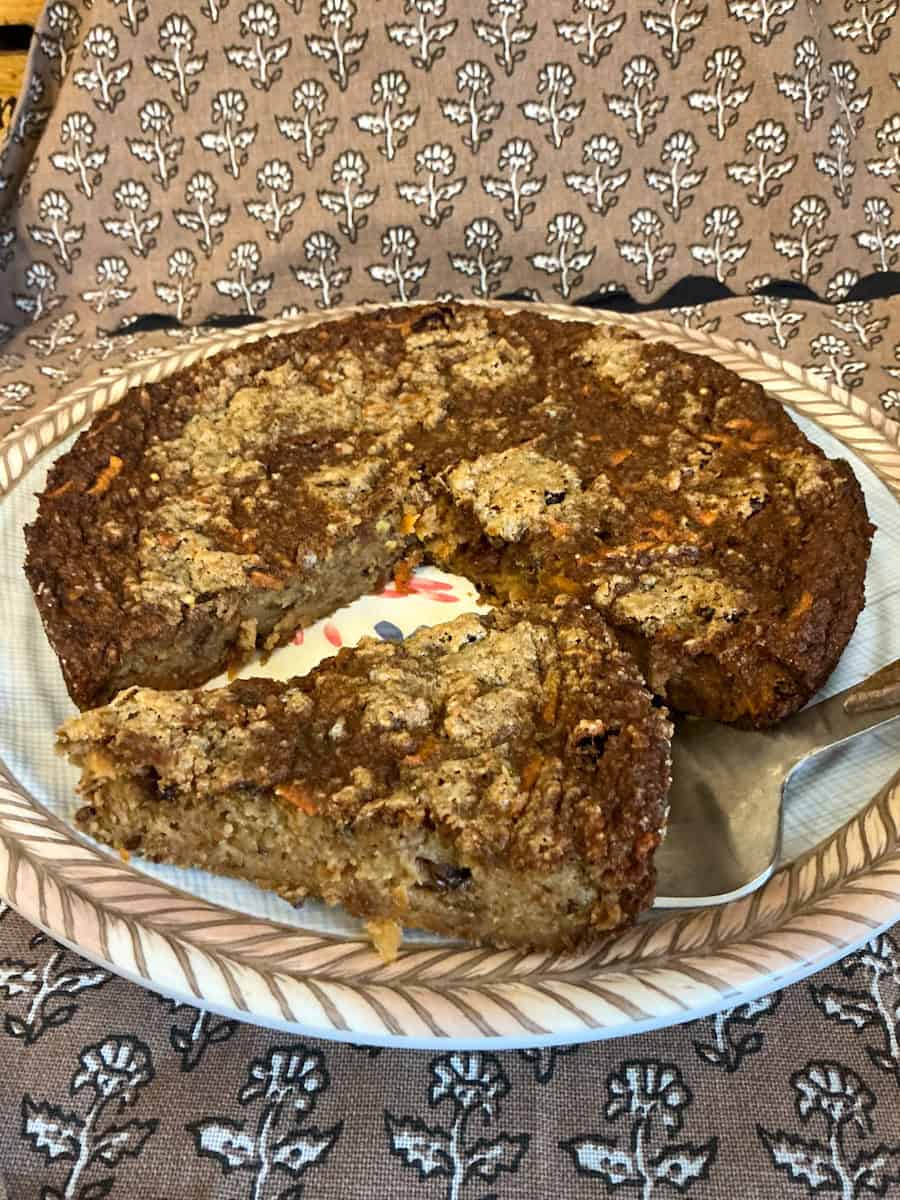Plate of Duke Pudding with a slice removed.