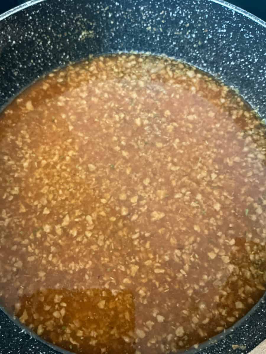 Water added and all ingredients stirred in the pan.